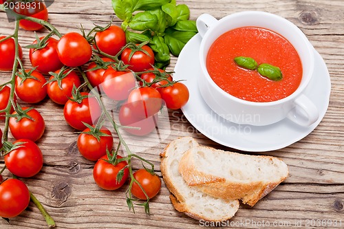 Image of tasty fresh tomato soup basil and bread