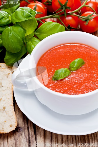 Image of tasty fresh tomato soup basil and bread