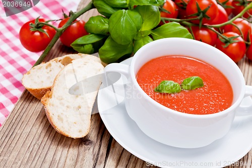 Image of tasty fresh tomato soup basil and bread