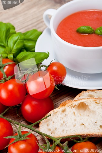 Image of tasty fresh tomato soup basil and bread