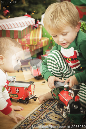 Image of Young Boy Enjoying Christmas Morning Near The Tree