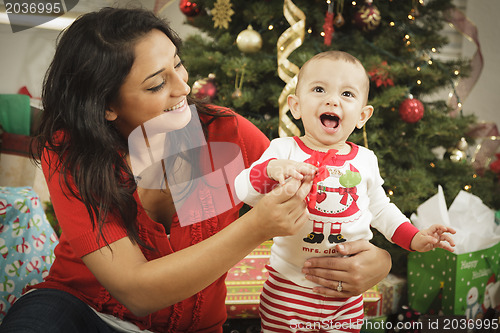 Image of Ethnic Woman With Her Newborn Baby Christmas Portrait