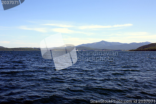 Image of Sea landscape. Waves of sea of Japan and island in a distance. Russia