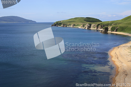 Image of Sea landscape. Waves of sea of Japan and island in a distance. Russia