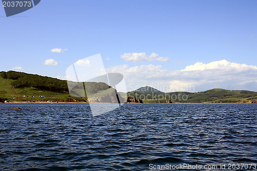 Image of Sea landscape. Waves of sea of Japan and island in a distance. Russia