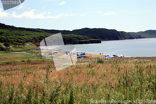 Image of Beach with having a rest people on island "Putjatin". Russia