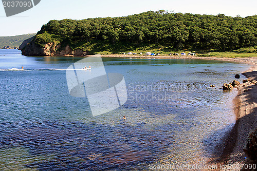 Image of Beach with having a rest people on island "Putjatin". Russia