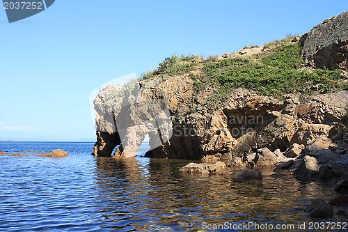 Image of Rock with the name "the Elephant drinking water". Russia. Island "Putjatin"