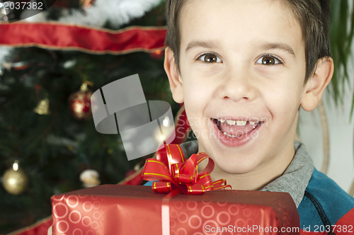 Image of Happy child receive the gift of Christmas