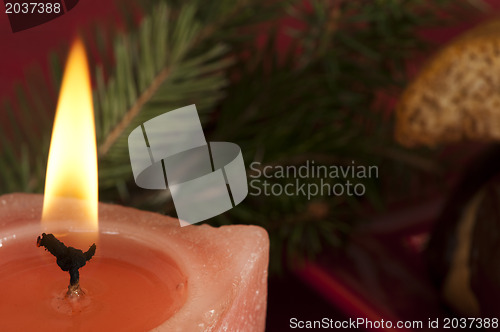 Image of Christmas candle on the festive table