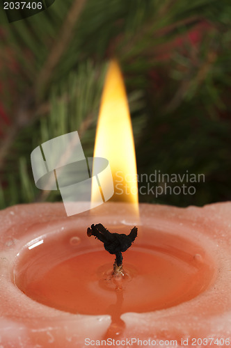 Image of Christmas candle on the festive table