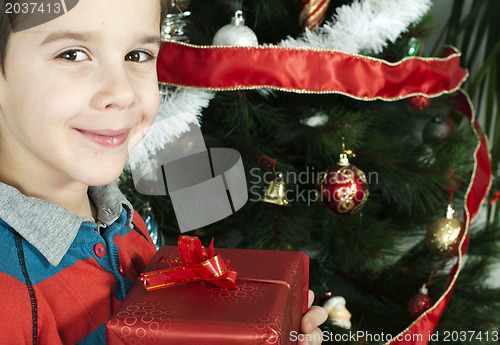 Image of Happy child receive the gift of Christmas