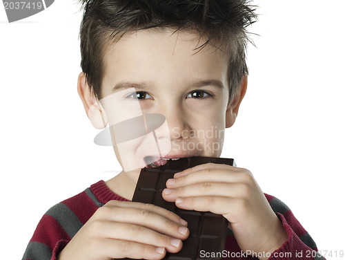 Image of Smiling kid eating chocolate