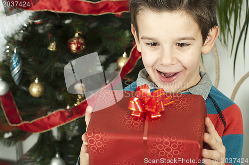 Image of Happy child receive the gift of Christmas