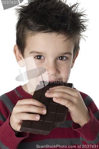 Image of Smiling kid eating chocolate