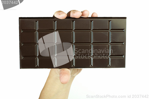 Image of Hand holding chocolate bar