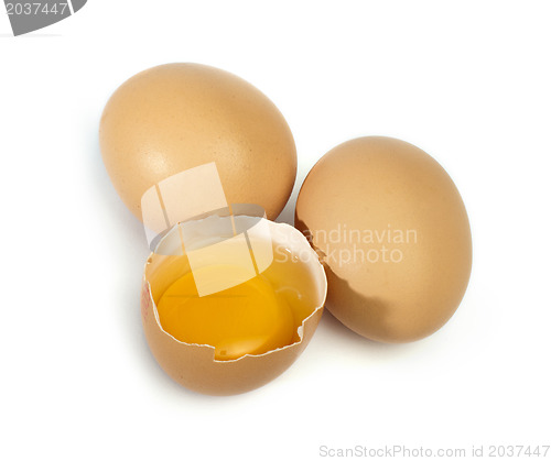 Image of Tree whole eggs and another broken in half raw egg