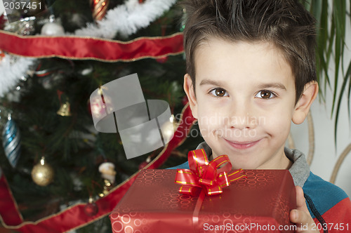 Image of Happy child receive the gift of Christmas