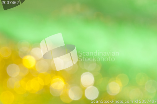 Image of Holiday shiny blurry lights in yellow colors