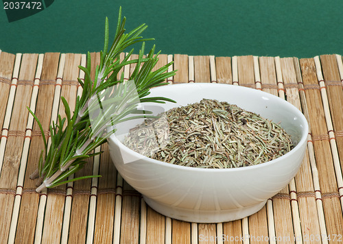 Image of Fresh rosemary and a bowl with dried