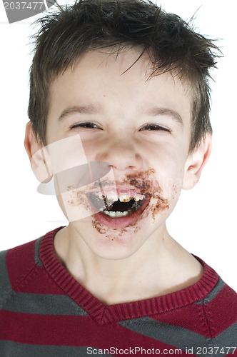 Image of Smiling little boy eating chocolate