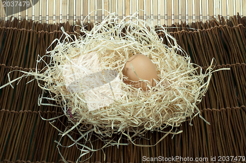 Image of Raw eggs in straw