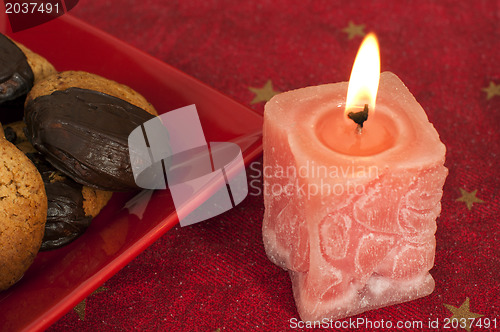 Image of Christmas sweets and candle