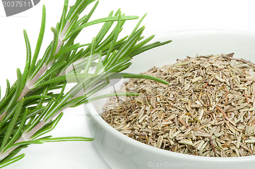 Image of Fresh rosemary and a bowl with dried