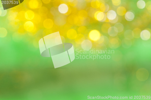 Image of Holiday shiny blurry lights in yellow colors
