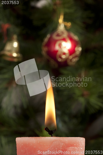 Image of Christmas candle on the festive table