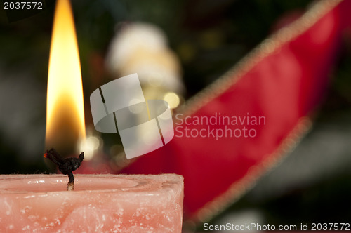 Image of Christmas candle on the festive table