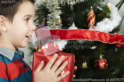 Image of Happy child receive the gift of Christmas