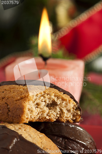 Image of Christmas sweets and candle on the table