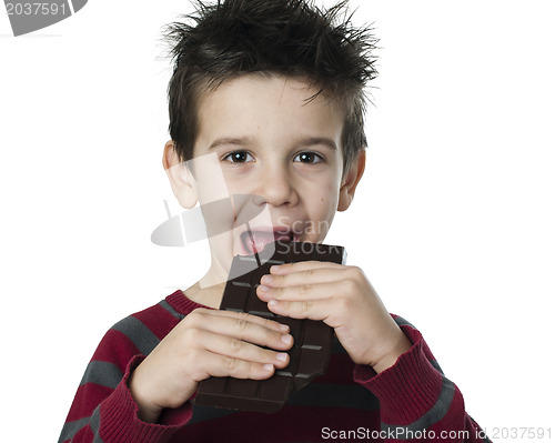 Image of Smiling kid eating chocolate