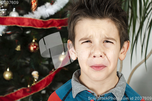 Image of Unhappy little boy on christmass