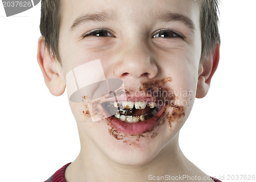 Image of Smiling little boy eating chocolate