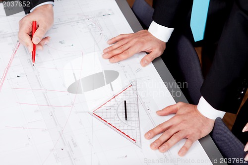 Image of business people discussing architecture plan sketch 