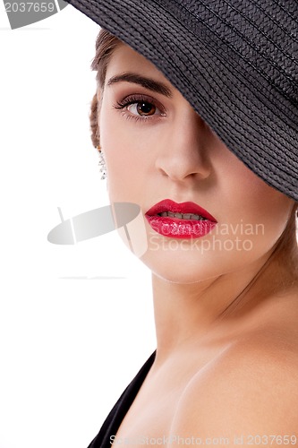 Image of glamour woman with black hat and red lips