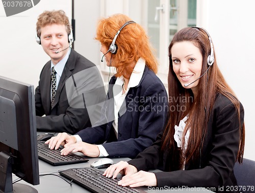 Image of callcenter service team talking with headset