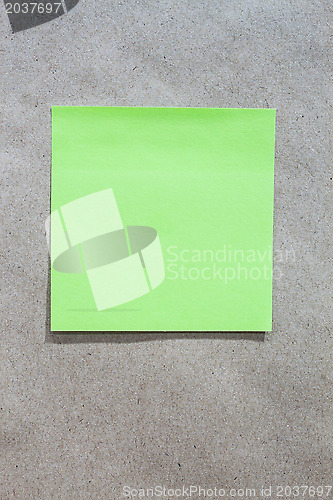 Image of Brown gradient paper background with green note paper 