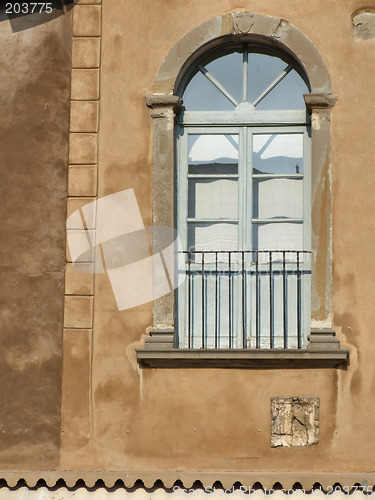 Image of Decorative window on a brown wall