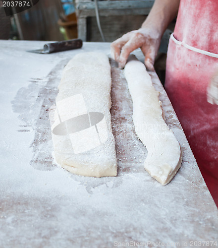 Image of Threshing and cutting flour of deep fried dough stick 