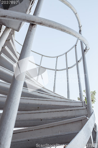 Image of White iron steps of spiral staircase 