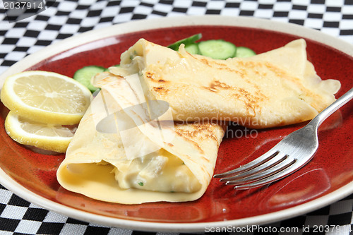 Image of Crepe filled with chicken in sauce
