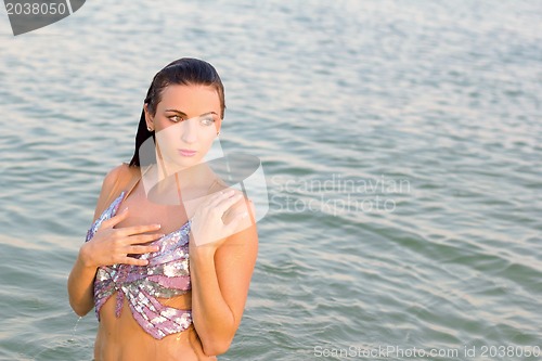 Image of sexy wet young woman in the water