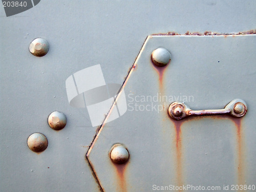Image of Old metal plate with bolts