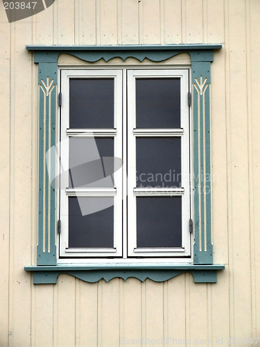 Image of Window on a bright yellow wall