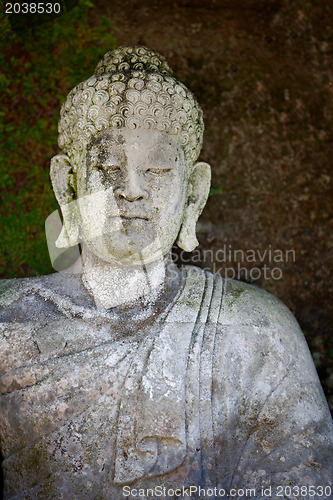 Image of Old stone Buddha statue. Indonesia, Bali.