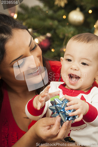 Image of Ethnic Woman With Her Mixed Race Baby Christmas Portrait