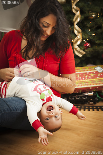 Image of Ethnic Woman With Her Mixed Race Baby Christmas Portrait